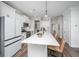 Bright kitchen with white cabinets, stainless steel appliances, and an expansive island at 203 O'Malley Dr, Summerville, SC 29483