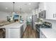 Modern kitchen with an island, stainless steel appliances, open to the dining and living area at 203 O'Malley Dr, Summerville, SC 29483
