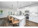 Modern kitchen featuring white cabinets, stainless steel appliances, and a large island with seating at 203 O'Malley Dr, Summerville, SC 29483