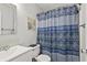 Bathroom featuring a toilet and sink with a decorative blue curtain that separates the shower area at 2030 Coldspring Dr # 708, North Charleston, SC 29406
