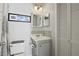 Cozy bathroom featuring a vanity sink with mosaic backsplash, decorative mirror and ample storage space at 2030 Coldspring Dr # 708, North Charleston, SC 29406