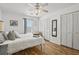 Comfortable bedroom with hardwood floors, a ceiling fan, and ample closet space at 2030 Coldspring Dr # 708, North Charleston, SC 29406
