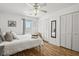 Sunlit bedroom with hardwood floors, a king bed, and neutral decor, with ample closet space and natural light at 2030 Coldspring Dr # 708, North Charleston, SC 29406