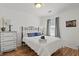 Bright bedroom features a cozy bed, nightstand, and ample natural light for a comfortable ambiance at 2030 Coldspring Dr # 708, North Charleston, SC 29406