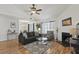 Inviting living room with vaulted ceilings, a cozy fireplace, and ample natural light through large windows at 2030 Coldspring Dr # 708, North Charleston, SC 29406