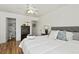 Bright bedroom with a ceiling fan, hardwood floors, and an ensuite bathroom at 2030 Coldspring Dr # 708, North Charleston, SC 29406