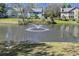 Community pond view showcases serene water feature and surrounding townhouse exteriors in a scenic location at 2030 Coldspring Dr # 708, North Charleston, SC 29406