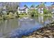 Beautiful community pond with a fountain surrounded by lush trees and landscaping at 2030 Coldspring Dr # 708, North Charleston, SC 29406