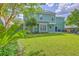 Spacious backyard featuring well-manicured lawn, patio area, and verdant trees, perfect for relaxation and outdoor activities at 219 Silverwood Ln, Summerville, SC 29485