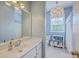 Well-lit bathroom featuring a single sink vanity and a neutral color scheme, providing a clean and calming space at 219 Silverwood Ln, Summerville, SC 29485