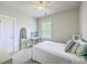 Neutral bedroom featuring bright window, unique mirror, and white bedding and walls at 219 Silverwood Ln, Summerville, SC 29485