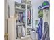 Walk in closet featuring rows of shelving, hanging racks, and personal decorations at 219 Silverwood Ln, Summerville, SC 29485