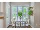 Cozy dining area features a bright window and unique decor at 219 Silverwood Ln, Summerville, SC 29485