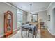 Cozy dining room with modern table and chairs, complemented by a vintage grandfather clock at 219 Silverwood Ln, Summerville, SC 29485