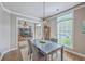 Bright dining room that opens to the foyer and features a modern table and chairs at 219 Silverwood Ln, Summerville, SC 29485