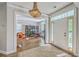 Bright foyer with hardwood floors and view into living space with built-in bookcase at 219 Silverwood Ln, Summerville, SC 29485