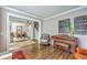 Cozy living room showcases hardwood floors and entry into dining room with piano at 219 Silverwood Ln, Summerville, SC 29485