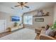 Comfortable living room featuring a flatscreen TV, decorative fan and a fluffy rug creating a warm atmosphere at 219 Silverwood Ln, Summerville, SC 29485