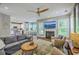 Cozy living room with a fireplace, comfortable seating, and an open layout leading to the kitchen at 219 Silverwood Ln, Summerville, SC 29485