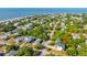 Aerial view of property and neighborhood with mature trees close to the ocean at 2501 Myrtle St, Edisto Beach, SC 29438