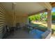 Covered patio features a picnic table and view of large backyard at 2501 Myrtle St, Edisto Beach, SC 29438
