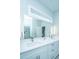 Elegant bathroom featuring a large mirror, contemporary lighting, and double sinks at 2501 Myrtle St, Edisto Beach, SC 29438