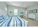 Comfortable bedroom features a plush bed, modern TV, and neutral decor at 2501 Myrtle St, Edisto Beach, SC 29438