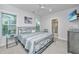 This bedroom features neutral paint, carpet, natural light, ceiling fan, and attached bathroom at 2501 Myrtle St, Edisto Beach, SC 29438