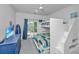 Bright bedroom with a custom built-in bunk bed with a queen bed on the bottom and a twin on top at 2501 Myrtle St, Edisto Beach, SC 29438