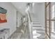 Hallway with staircase, light gray walls, and wood look tile flooring at 2501 Myrtle St, Edisto Beach, SC 29438