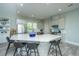 Modern kitchen featuring gray cabinets, stainless steel appliances, and a spacious island at 2501 Myrtle St, Edisto Beach, SC 29438
