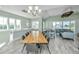 Open living space with dining area, living room, and lots of windows at 2501 Myrtle St, Edisto Beach, SC 29438