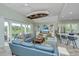 Inviting living room with a boat hanging from the ceiling, leading to a kitchen and dining area at 2501 Myrtle St, Edisto Beach, SC 29438