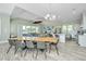 Large living space combining a dining area, kitchen, and living room with many windows at 2501 Myrtle St, Edisto Beach, SC 29438