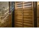 Rustic outdoor shower with wood panels and a shower head, creating a private space at 2501 Myrtle St, Edisto Beach, SC 29438