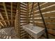 Covered outdoor sink area featuring a small sink and wooden paneling with light shining through at 2501 Myrtle St, Edisto Beach, SC 29438