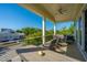 Spacious porch with outdoor seating, perfect for enjoying the view and fresh air at 2501 Myrtle St, Edisto Beach, SC 29438
