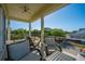 Relaxing porch with comfortable seating and a ceiling fan at 2501 Myrtle St, Edisto Beach, SC 29438