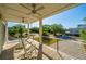 Relaxing porch with rocking chairs and ceiling fans offering serene views of the neighborhood at 2501 Myrtle St, Edisto Beach, SC 29438