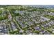 Panoramic aerial showcasing a residential area with lush greenery, a lake, and well-maintained homes at 2522 Daniel Island Dr, Daniel Island, SC 29492