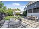 Landscaped backyard offers a fire pit, dining area, and lush greenery, perfect for outdoor gatherings at 2522 Daniel Island Dr, Daniel Island, SC 29492