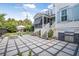 Expansive backyard patio with outdoor seating, a built-in grill, fire pit, and well-manicured lawn at 2522 Daniel Island Dr, Daniel Island, SC 29492