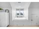 Charming bedroom featuring a cozy built-in bed, a large window, and bright white walls at 2522 Daniel Island Dr, Daniel Island, SC 29492