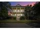 Stately two-story home with a covered front porch, lush landscaping, and inviting curb appeal at 2522 Daniel Island Dr, Daniel Island, SC 29492