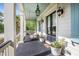 Cozy front porch features a hanging swing and stylish decor, offering a welcoming entryway to the home at 2522 Daniel Island Dr, Daniel Island, SC 29492