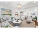 Open-concept living room with access to the kitchen is perfect for entertaining and creating a communal gathering space at 2522 Daniel Island Dr, Daniel Island, SC 29492