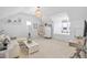 Bright living room featuring a hanging chair, plush furniture, and unique light fixtures at 2522 Daniel Island Dr, Daniel Island, SC 29492