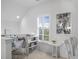 Bright loft area featuring a workspace, window with shutters, and neutral decor at 2522 Daniel Island Dr, Daniel Island, SC 29492