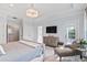 Main bedroom features bright natural light, soft paint, and stylish decorative chair at 2522 Daniel Island Dr, Daniel Island, SC 29492
