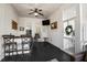 Inviting screened porch boasts black wood floors, white shiplap, a full bar, and stylish decor at 2522 Daniel Island Dr, Daniel Island, SC 29492